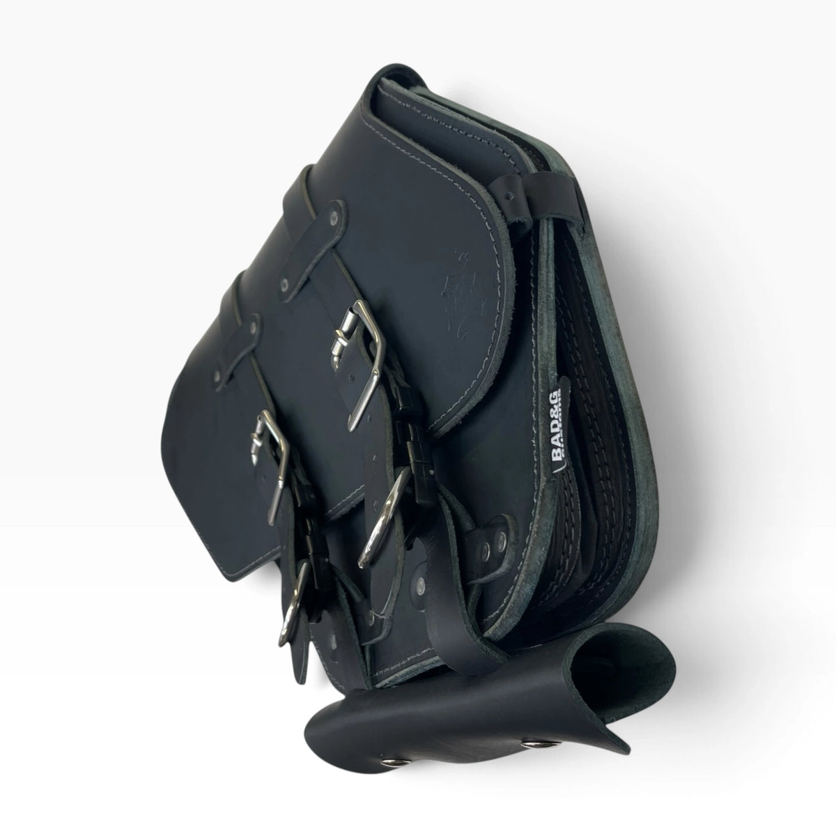 Black leather saddle bag with adjustable buckle straps and silver metal hardware, shown on a clean white background.