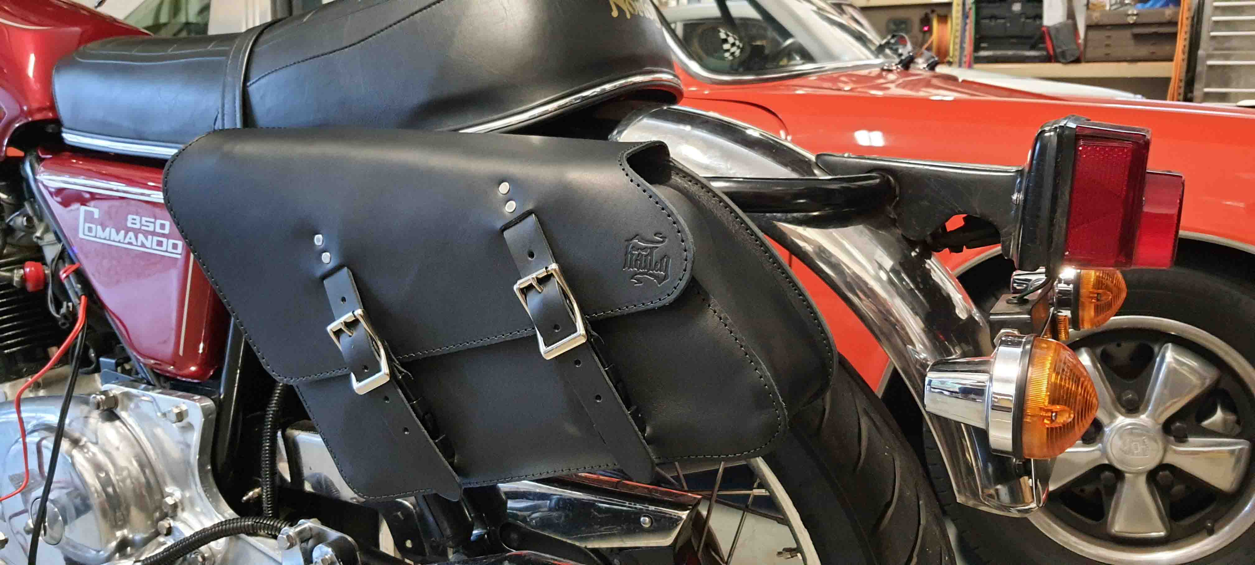 Norton Commando 850 classic motorcycle with vintage design and premium custom leather saddlebags for a perfect fit and timeless style.