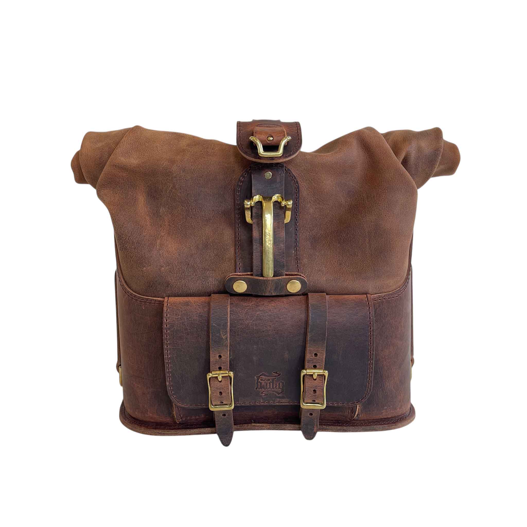 Triumph Bonneville Bobber Panniers Rolltop Swingarm Saddlebags. Hand crafted in USA with premium veg tan water buffalo leather, waterproof liners and solid brass hardware. BAD&G Customs TBP01