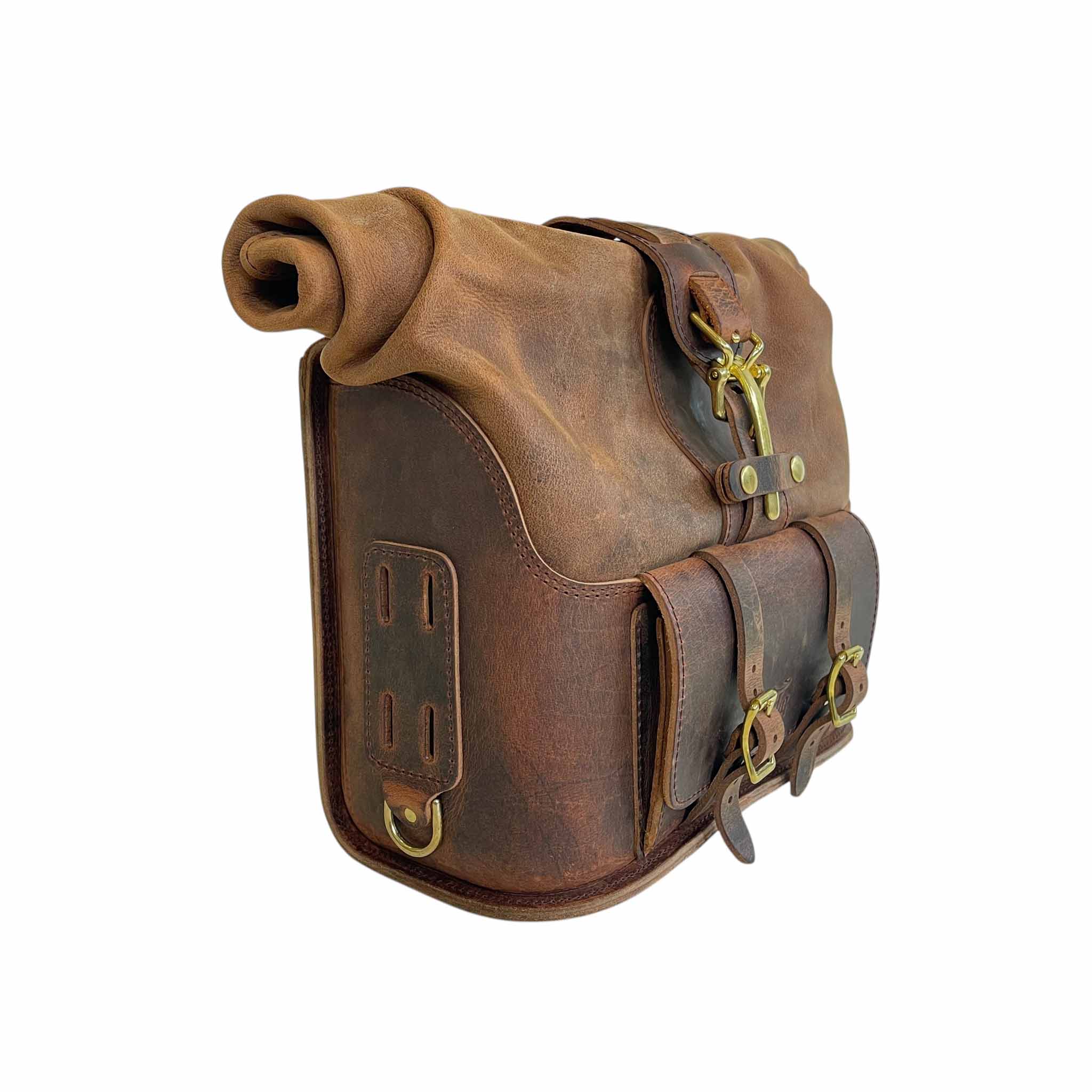 Triumph Bonneville Bobber Panniers Rolltop Swingarm Saddlebags. Hand crafted in USA with premium veg tan water buffalo leather, waterproof liners and solid brass hardware. BAD&G Customs TBP01
