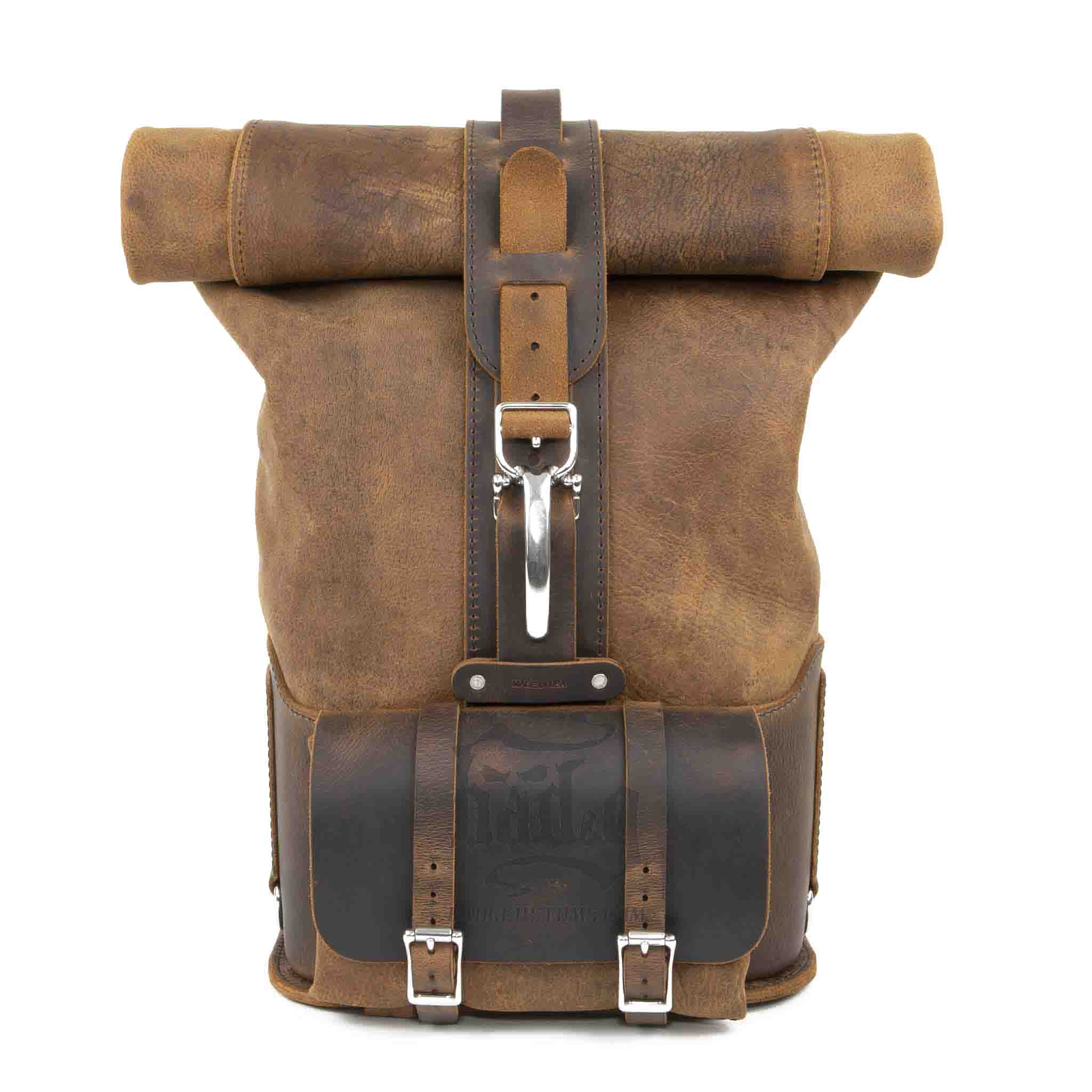 Upgrade your ride with the URB01 Rolltop Backpack Saddlebag. Unique design enables quick conversion from saddlebag to backpack. Hand crafted in USA with premium veg tan water buffalo leather and stainless steel hardware. Durable and stylish, it's the perfect fit for your motorcycle.