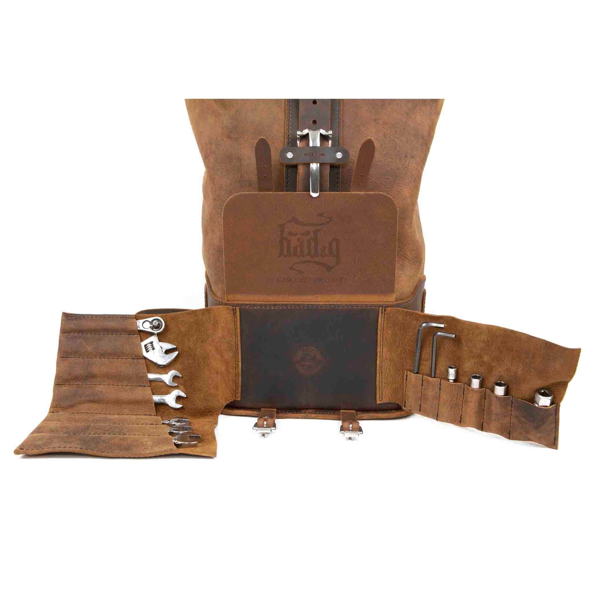 Upgrade your ride with the URB01 Rolltop Backpack Saddlebag. Unique design enables quick conversion from saddlebag to backpack. Hand crafted in USA with premium veg tan water buffalo leather and stainless steel hardware. Durable and stylish, it's the perfect fit for your motorcycle.