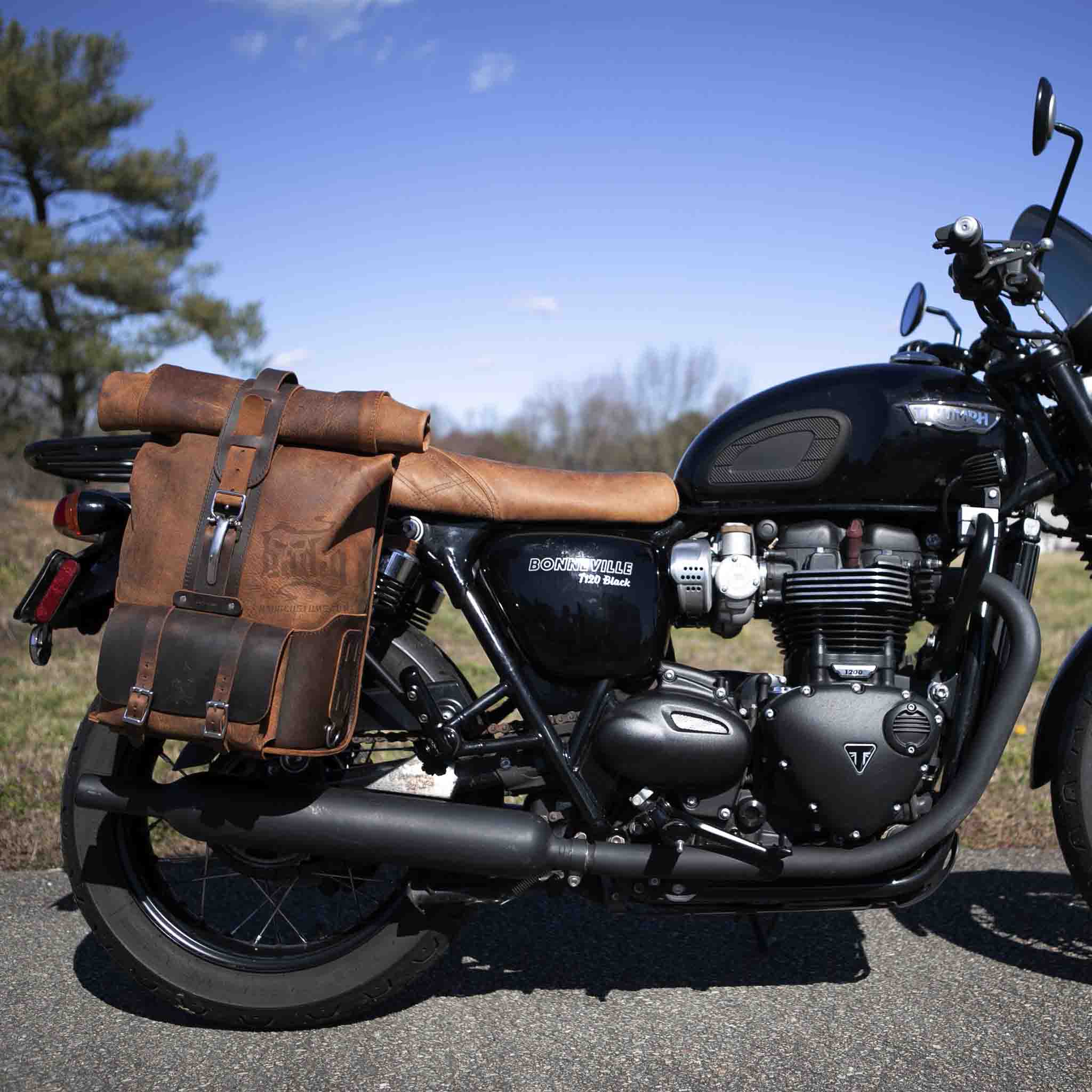 Upgrade your ride with the URB01 Rolltop Backpack Saddlebag. Unique design enables quick conversion from saddlebag to backpack. Hand crafted in USA with premium veg tan water buffalo leather and stainless steel hardware. Durable and stylish, it's the perfect fit for your motorcycle.