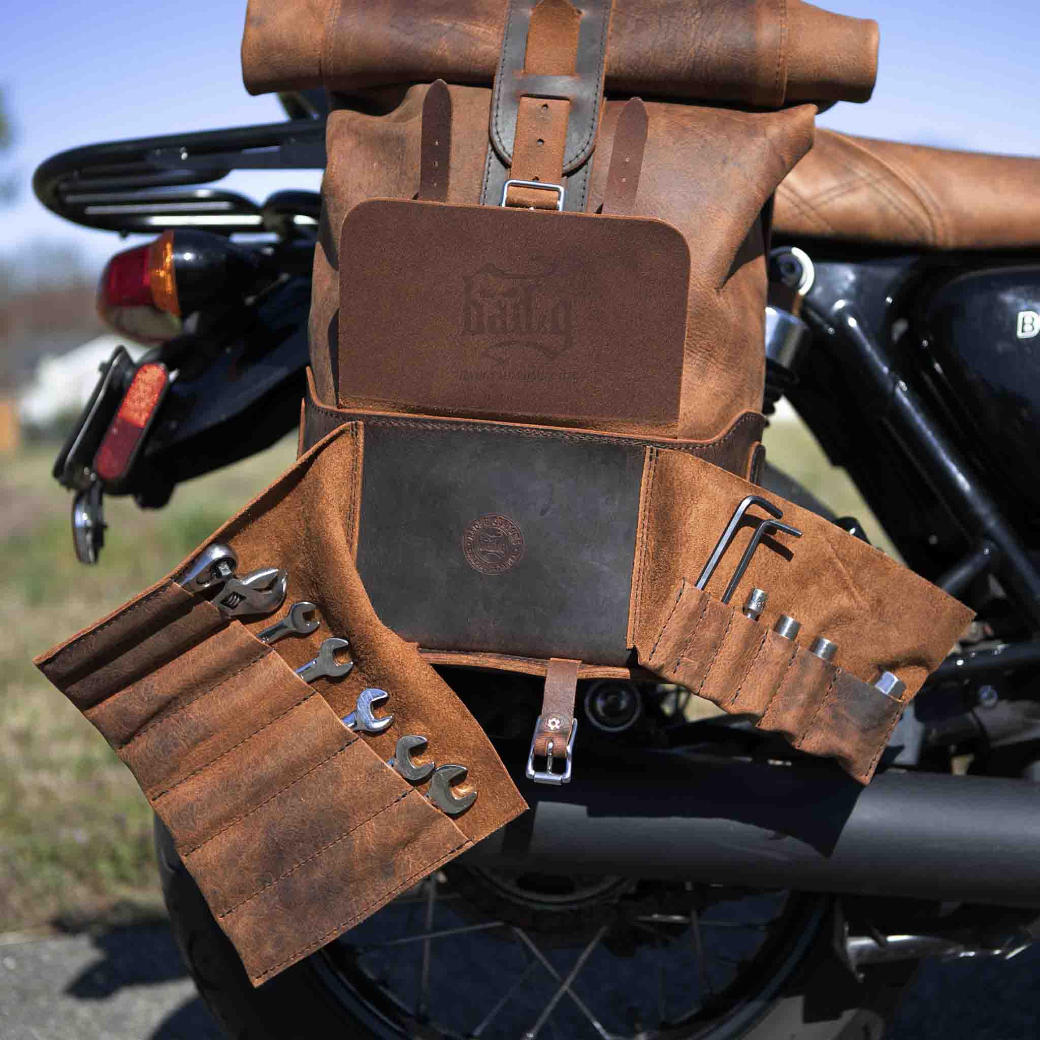 Upgrade your ride with the URB01 Rolltop Backpack Saddlebag. Unique design enables quick conversion from saddlebag to backpack. Hand crafted in USA with premium veg tan water buffalo leather and stainless steel hardware. Durable and stylish, it's the perfect fit for your motorcycle.
