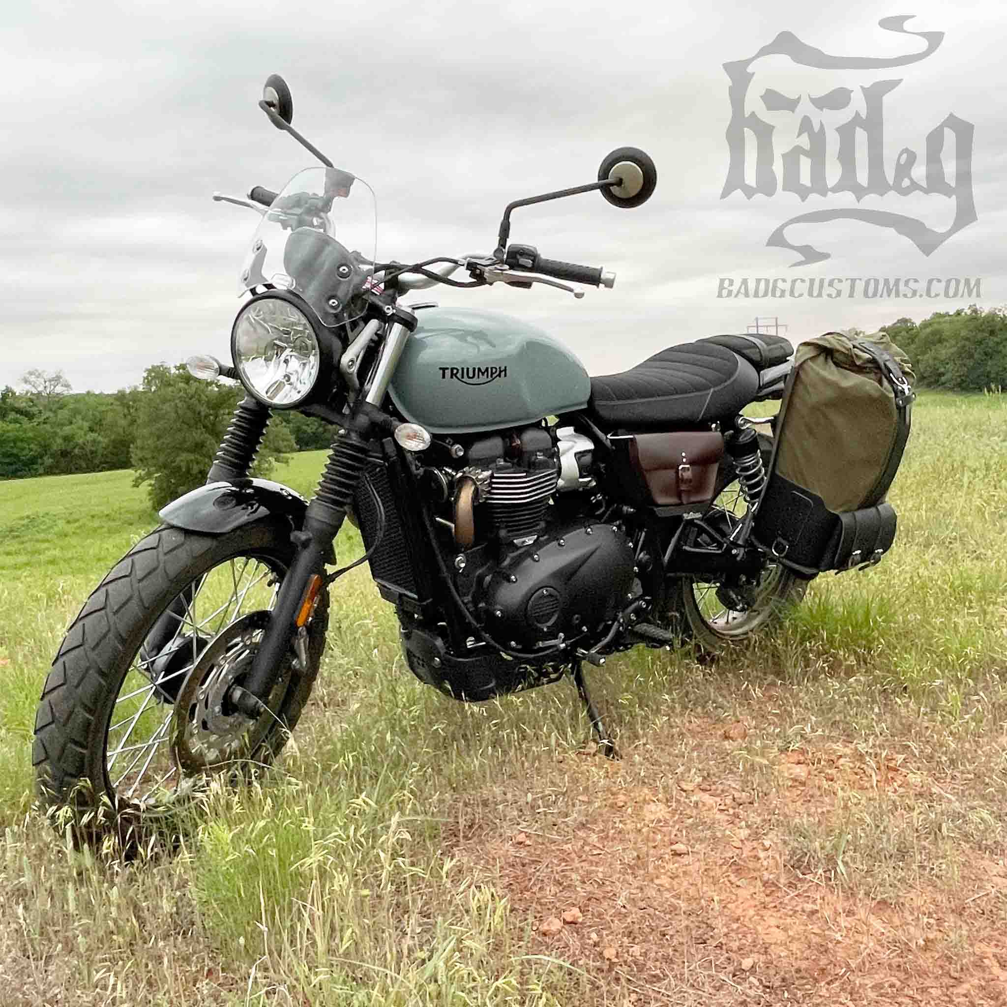 Upgrade your ride with the URB02 Rolltop Backpack Saddlebag. Unique design enables quick conversion from saddlebag to backpack. Hand crafted in USA with premium veg tan water buffalo leather, waxed canvas and stainless steel hardware. Durable and stylish, it's the perfect fit for your motorcycle.