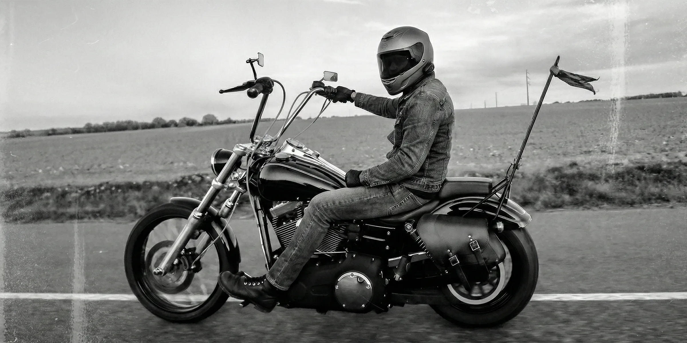 Rider on a Harley-Davidson Dyna featuring a custom leather saddlebag by BAD&G Customs. Apply to the Brand Ambassador program.